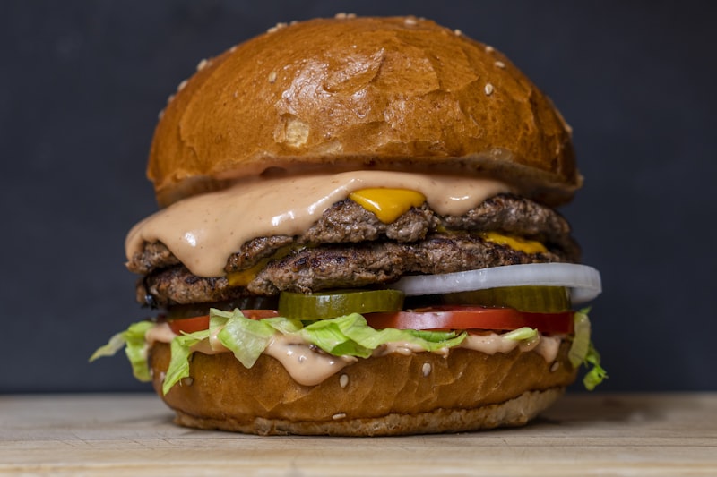 Plated gourmet burger with sides